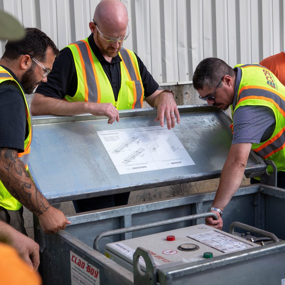 CCB team members inspecting equpiment