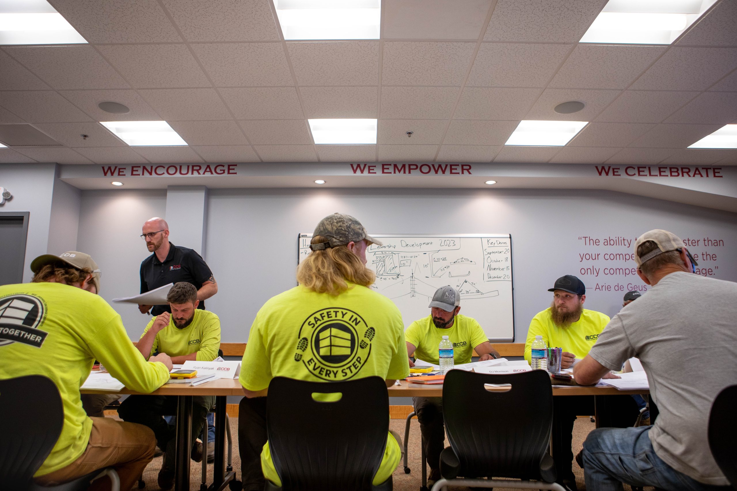 The CCB team in a board room receiving a training