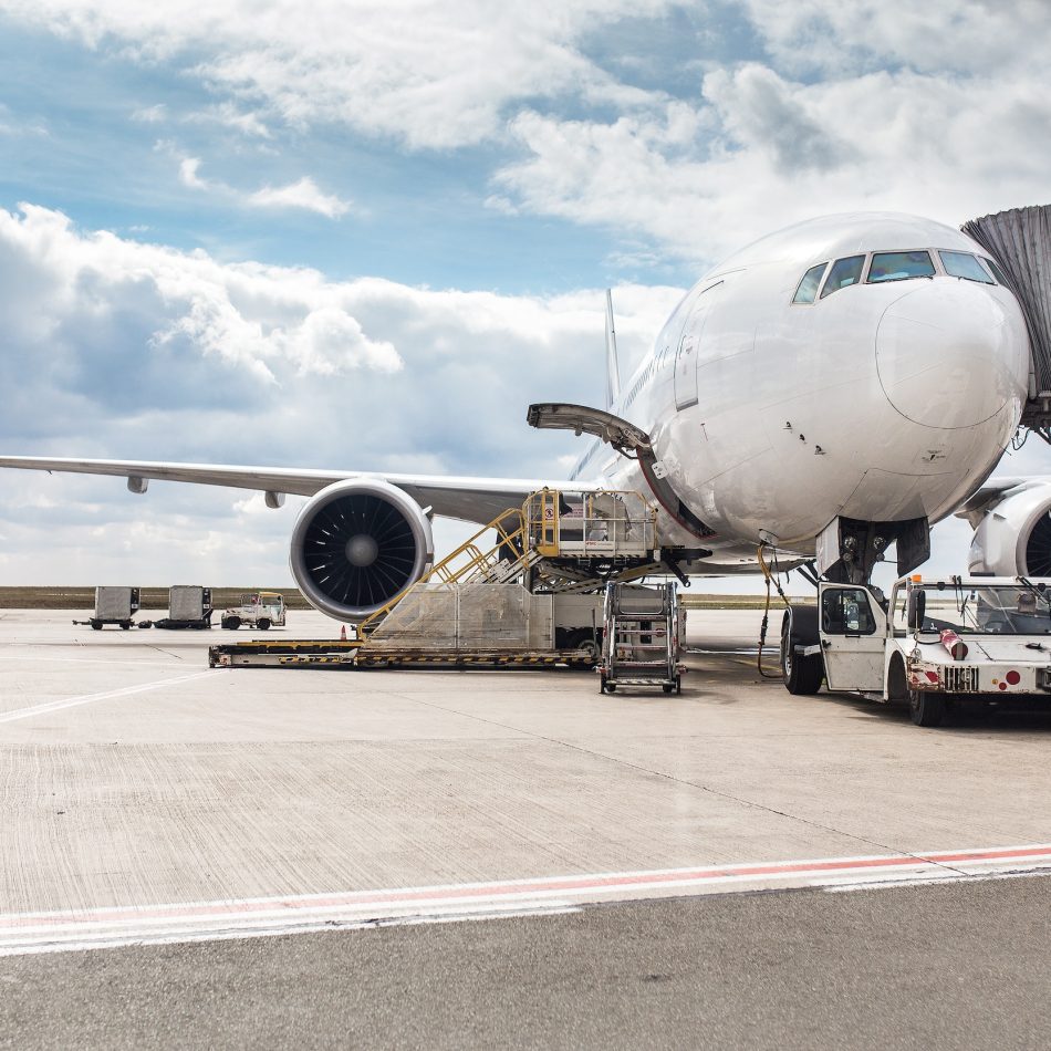 An airplane on the tarmac boarding