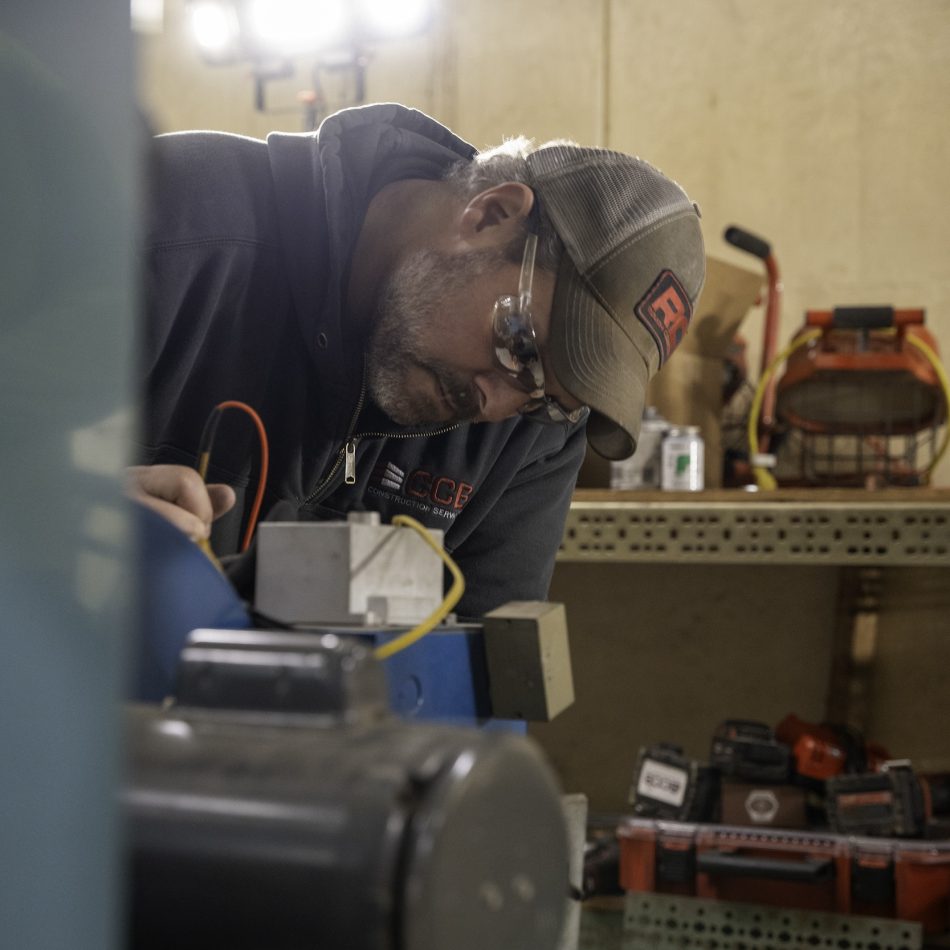 A CCB employee doing electrical work