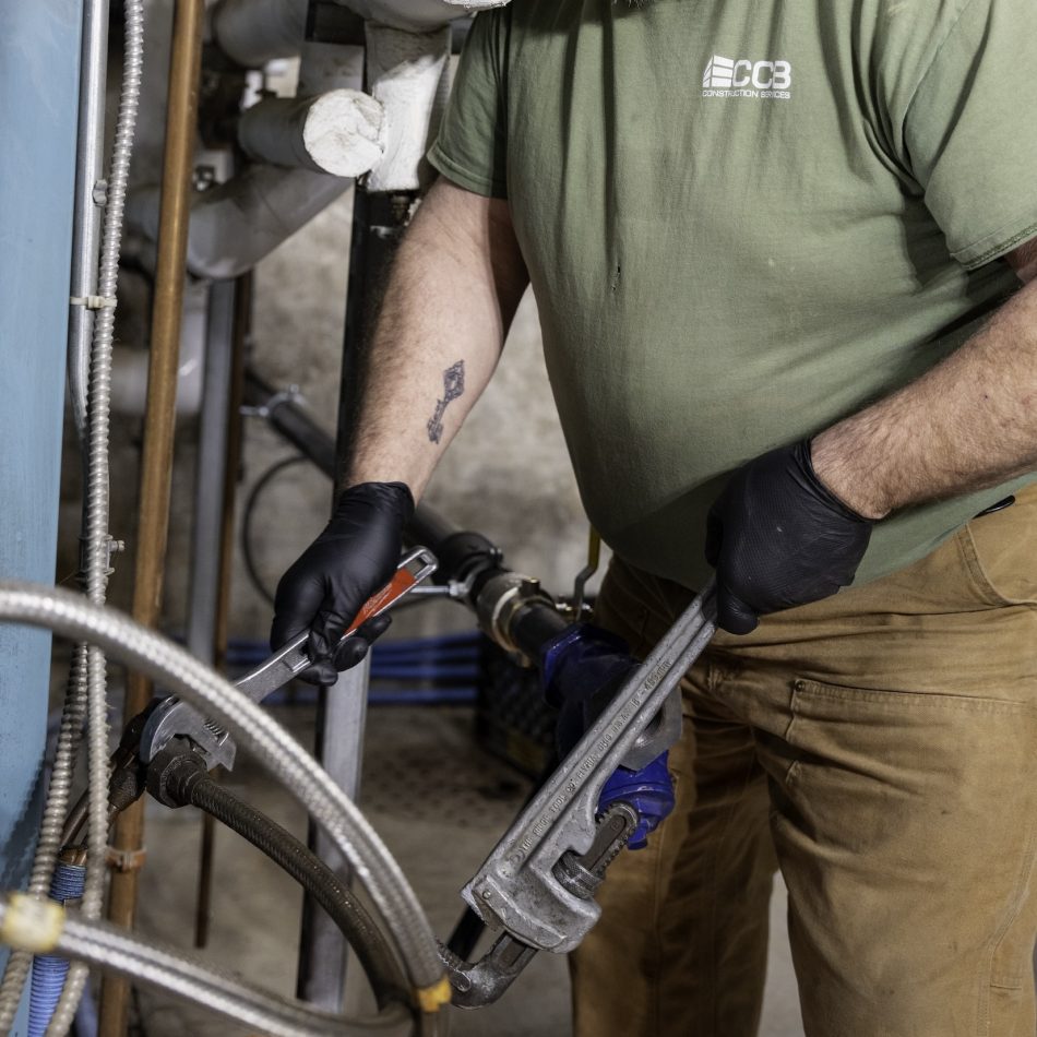 A man doing plumbing work