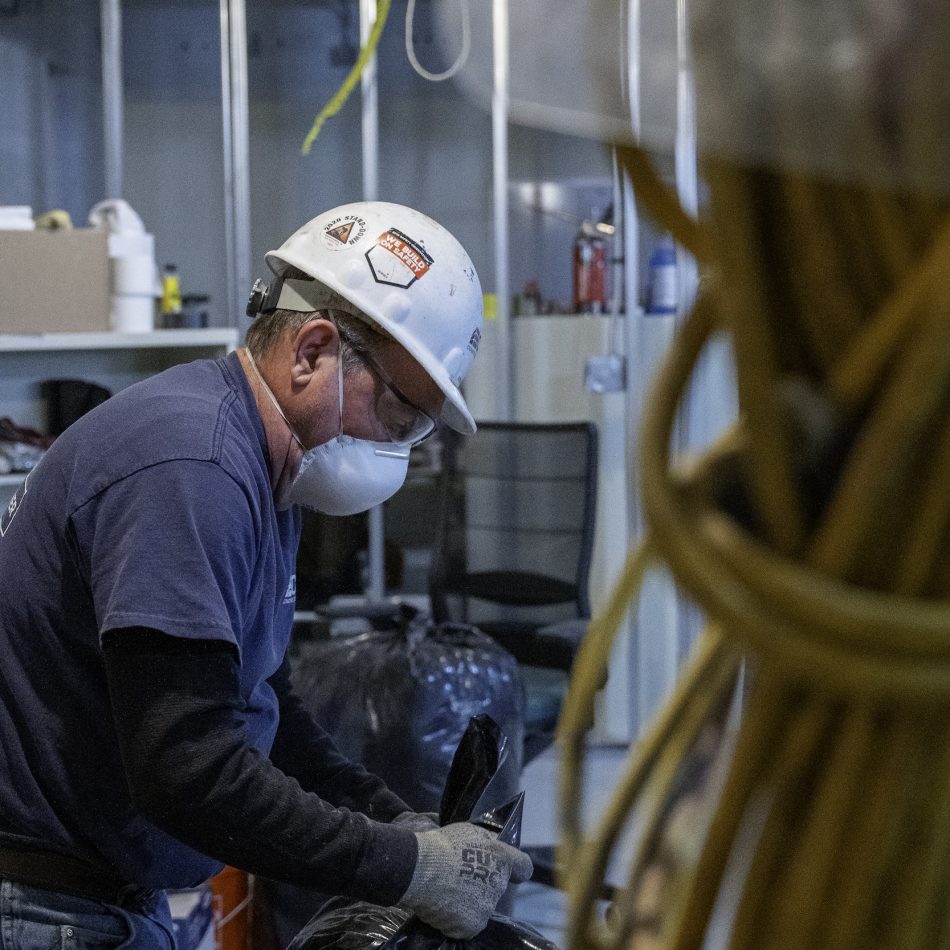 A worker wearing a mask in a construction setting