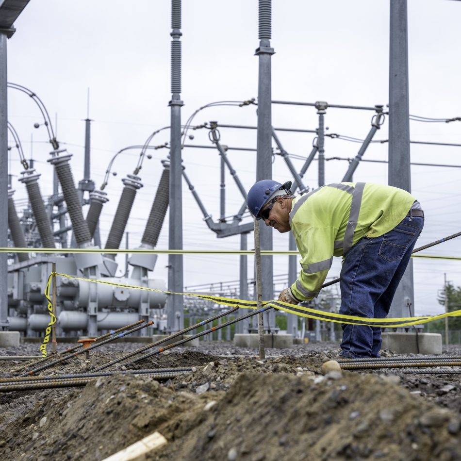 A worker at an electrical substation